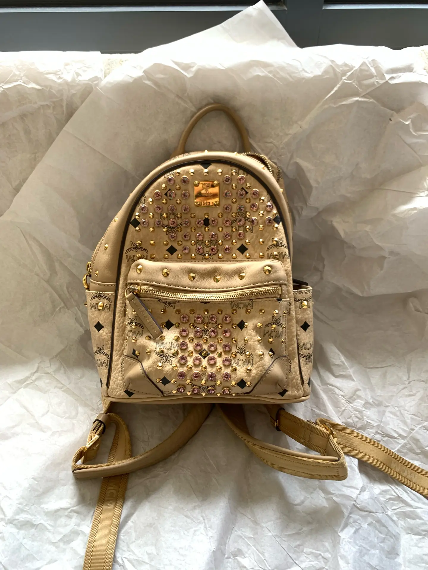 Pre-owned MCM Mini Backpack in Classic Visetos Monogram Canvas with Crystal Stud Embellishment. Size: 21 × 27 cm. No Accessories Included.