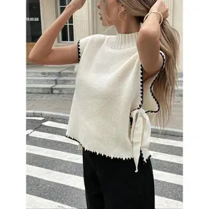 Women’s casual color-blocked knit cardigan vest with a side-sewn tie detail at the front, stand-up collar, and loose fit—fashionable for autumn and winter.