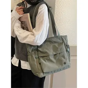 Large capacity women's bag Korean version 2025 new Japanese fashion simple Western style artistic one shoulder tote bag canvas bag college student computer bag handbag multi pocket simple casual armpit bag Casual commuter bag suitable for work, shopping