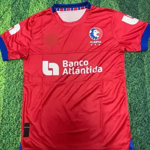 Olimpia Away Jersey - Red Soccer Shirt with Banco Atlántida Sponsorship Logo and Blue Trim Details