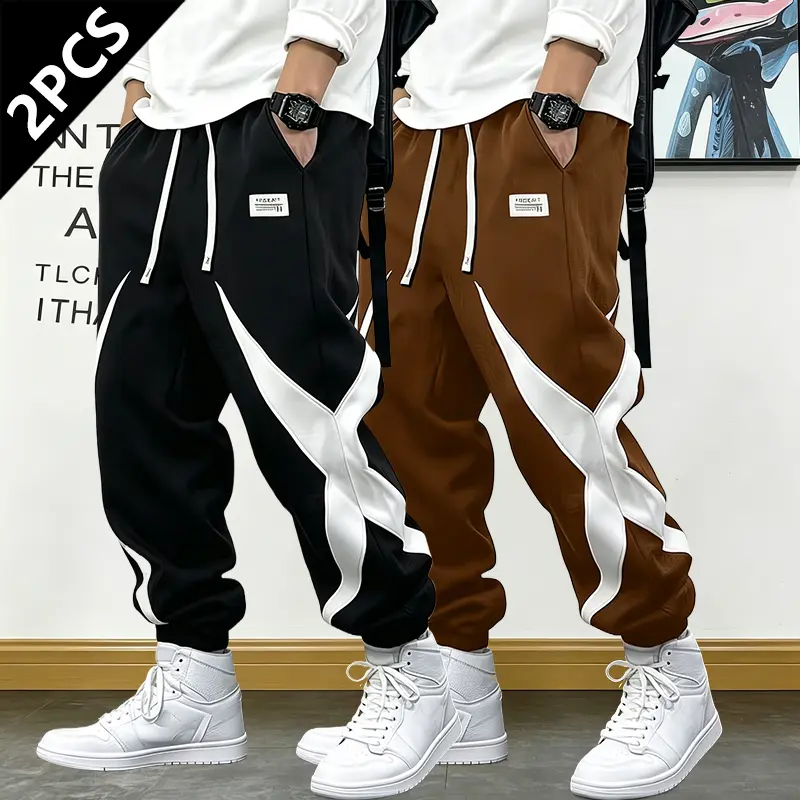 2-pack men’s all-season athletic joggers featuring a trendy patchwork design, contrasting colors, drawstring elastic waistband, and tapered cuffs—an ideal gift for men.