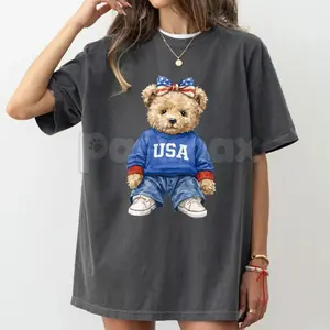 Patriotic Teddy Bear T-Shirt – USA Stars & Stripes Bow Graphic Tee | Viral Americana Aesthetic Top | Comfort Colors Pepper Grey Shirt