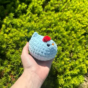 Pastel blue hand-crocheted chicken