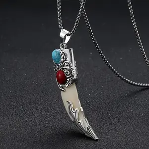 A vintage Bohemian style wolf tooth-shaped pendant necklace with turquoise inlay, suitable as a creative unisex gift for friends or as a Christmas present