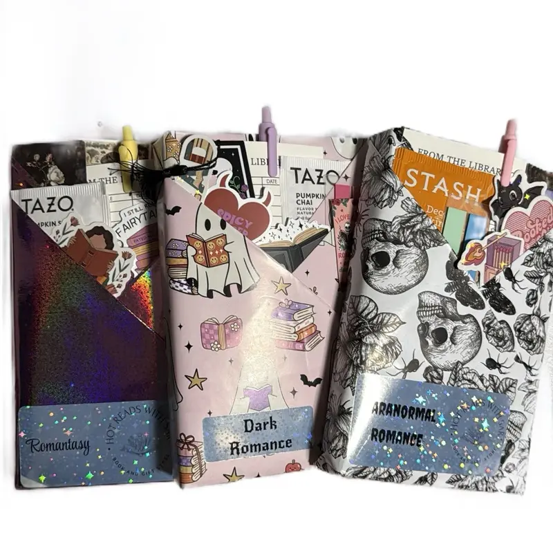 Triple Blind Date With A Book- 3  BDWB! This includes three paperback books, colorful page tabs, a handcrafted tea blend, fun stickers, a reading tracker, a stylish bookmark, and a vibrant colored pen for the ultimate reading experience. Bookish Vibe