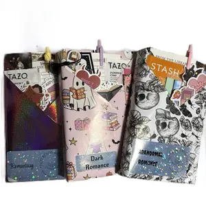 Triple Blind Date With A Book- 3  BDWB! This includes three paperback books, colorful page tabs, a handcrafted tea blend, fun stickers, a reading tracker, a stylish bookmark, and a vibrant colored pen for the ultimate reading experience. Bookish Vibe