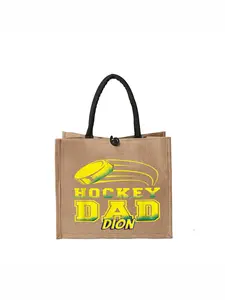 Simple Linen Tote Bag, Printed Handbag"HOCKEY DAD" Graphic Jute Tote Bag - Durable Brown Burlap Carryall with Black Handle and Toggle Closure, Stylish Yellow Hockey Puck Design, Perfect for Sports Fans and Daily Use.Large Capacity, Reusable, Ideal