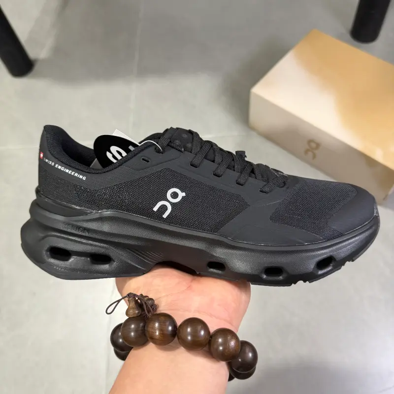 Cushioned running trainers with segmented hollow foam midsoles evenly absorbing harsh impact on long daily walks, premium stretch breathable knit mesh in solid matte black, lugged grippy rubber outsole