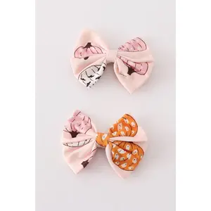 Pink pumpkin piggie hair bow