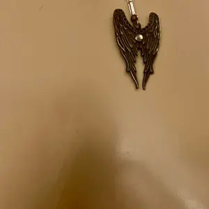 Rebeccaswares Angle wing necklace, built by energy placement to enhance wearability, beautiful conversation piece, designer brand