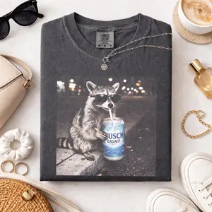 Comfort Colors Vintage Raccoons BuschLight T-Shirt with funny Gen Z dank meme design, trendy animal graphic tee, cotton streetwear gift for men and women alike - ShamCren