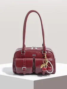 A niche, personalized, large capacity, fashionable and textured shoulder bag with cherry and pearl pendant decoration design, and multiple zippered pockets, suitable for daily commuting, shopping, and gatherings