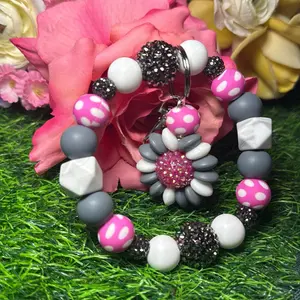 Polka storm wristlet keychain color scheme white, grey, polka dot print and bling beads made with  wire