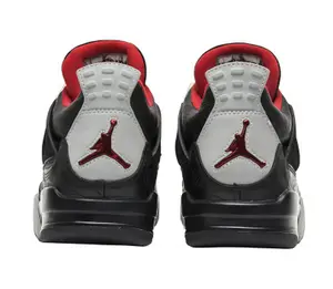 Black Laser-Etched Texture High-Top Sneakers with Red Laces and Off-White Plastic Eyelets, Black Mesh Ventilation Details, Grey Midsole with Black Outsole, Visible Heel Air Unit, and Triangular Suppor