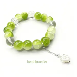 Green Crystal Bead Bracelet with Flower Charm - Lustrous Green Beads & Clear Crystal Accents for Nature-Inspired Elegance