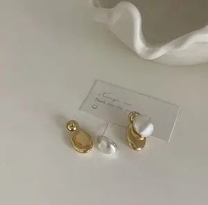 Brushed and Smooth textured metal Layered Stud Earring many different ways of wearing it joelle earring original