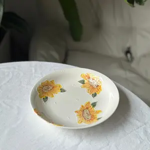 Handmade pottery plate with yellow orange sunflower. Flower ceramic tableware. Birthday, wedding, festival gift.