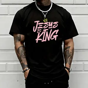 Men’s “Jesus Is King” Christian graphic T-shirt featuring pink script and crown print, made from a soft cotton blend—perfect for faith-inspired fashion lovers, streetwear enthusiasts, and everyday spiritual outfits.