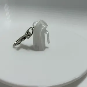 Urinal badge keychain