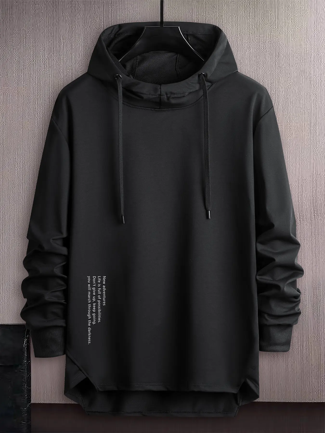 Men’s pullover hoodie with side vertical English print, smooth stretchy knit fabric, relaxed drop-shoulder design, irregular hem, long sleeves, minimalist text print—trendy casual top for spring/autumn, versatile men’s hooded sweatshirt.