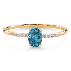 Gem Stone King 10K Yellow Gold Oval London Blue Topaz and White Lab Grown Diamond Engagement Ring For Women (0.65 Cttw, Oval 6X4MM, Gemstone November Birthstone)