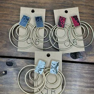 In true Charming Lane Boutique fashion, the snakeskin and gold hoop combo makes this a statement earring.