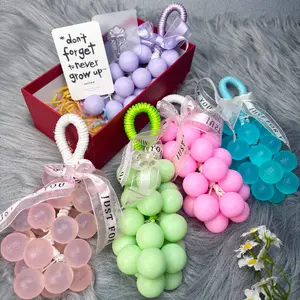 Fruit shaped hanging bath bar, grape design soap, aromatic body bar, long lasting fragrance, rich lather skincare, spa style bathing, bathroom accessory, giftable bath item, eco friendly, everyday wash