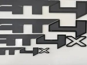 GMC "AT4 X" Emblem Set