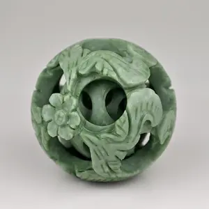 Intricately Hand-Carved Green Jade Sphere with Floral Design - Symbol of Harmony and Renewal