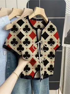 Women's khaki bohemian vacation short-sleeve knit top. Loose round neck, contrast diamond print, front tie and contrast piping. Comfortable and stylish for spring & summer casual wear.