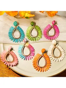 European and American cross - border personalized, exaggerated and colorful raffia earrings. Women's geometric water - drop hollow earrings with a vacation - style beach theme.