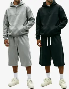 Men’s half-zip hooded sweatshirt and 3/4 pants set, available in two colors, featuring a relaxed drop-shoulder design and soft fabric, suitable for everyday commuting, streetwear styling, and casual outings.