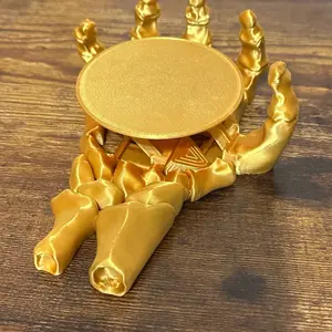 Skeleton hand self adjusting coaster