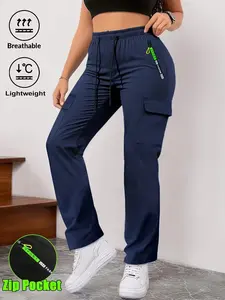 Women’s spring/autumn cargo pants with green letter print, zippered pockets, large patch pockets, drawstring elastic waistband—fashionable casual outdoor long pants suitable for jogging and everyday wear.