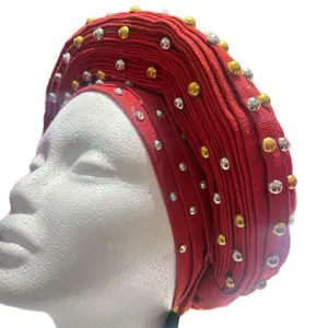 Pepper Dem Red Luxury Aso Oke Ready to wear African Headwear embellished with gold and silver studs.