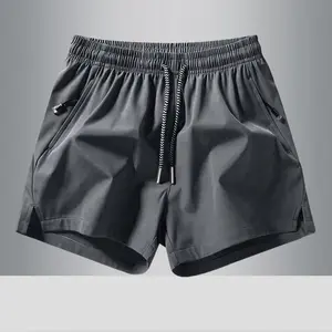 Boys’ quick-dry fitness running shorts: lightweight athletic shorts with an elastic drawstring waist and zippered pockets—suitable for hiking, everyday wear, gym training, basketball, soccer, and other sports; available in a wide range of colors.