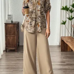 Women's floral print V-neck chest fake button long sleeved top, wide leg pants version, solid color pants two-piece set