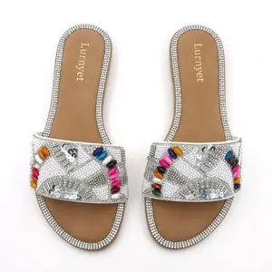 Sparkling, dazzling women’s fashion slides — flat sandals filled with glitter, soft and comfortable for summer beachwear, travel, and everyday wear