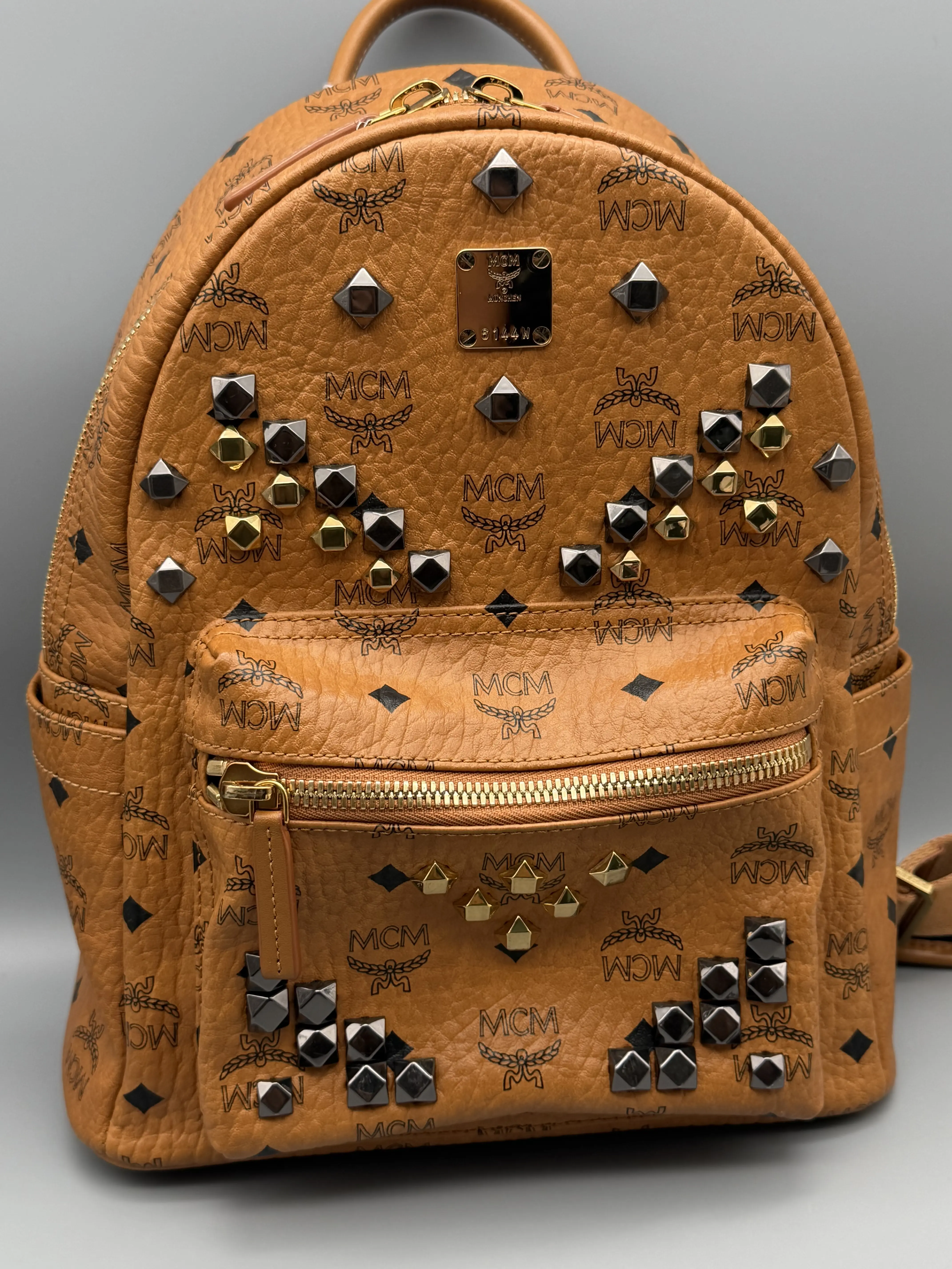 Pre-owned MCM Canvas & Leather Backpacks Visetos Studded Backpack Cognac | Mini Stark Backpack Leather Trim