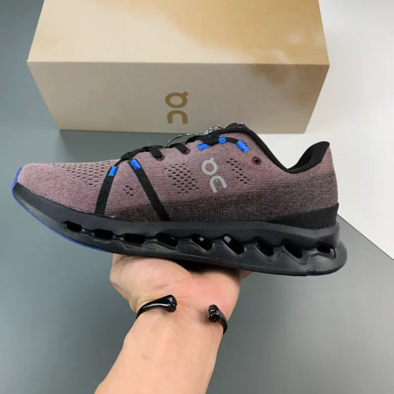 Purple black bright blue hollow cushioned low-top running trainers featuring scuff-proof blue black rubber outsoles, tear-resistant sweat-wicking stretch knit mesh construction, full wavy hollow lightweight foam midsole layout