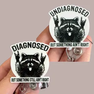 Glitter My Badge Undiagnosed and diagnosed but something isn’t right raccoon set of 2 badge reels for nurse and hospital workers. Badge clip Badge pull - Retractable swivel clip with a 360 rotation. Great gift for coworker. Badge reel for men.