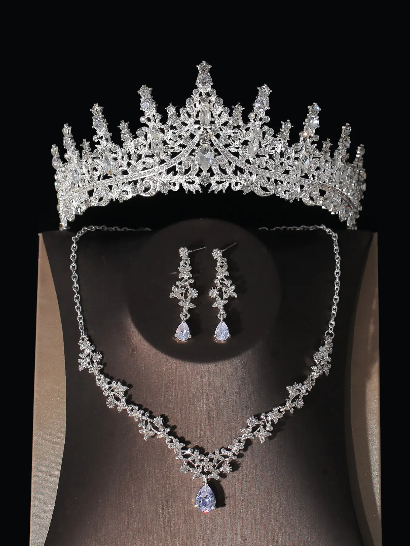A set of classic rhinestone crown, necklace, and earrings for a female  bride, consisting of 4