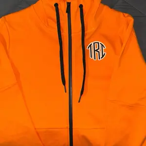 TRI-Fecta Sweatsuits - Orange Hooded Zip up Jacket with Logo, Front Pocket, Drawstring Hood, and Orange/Black Sweatpants