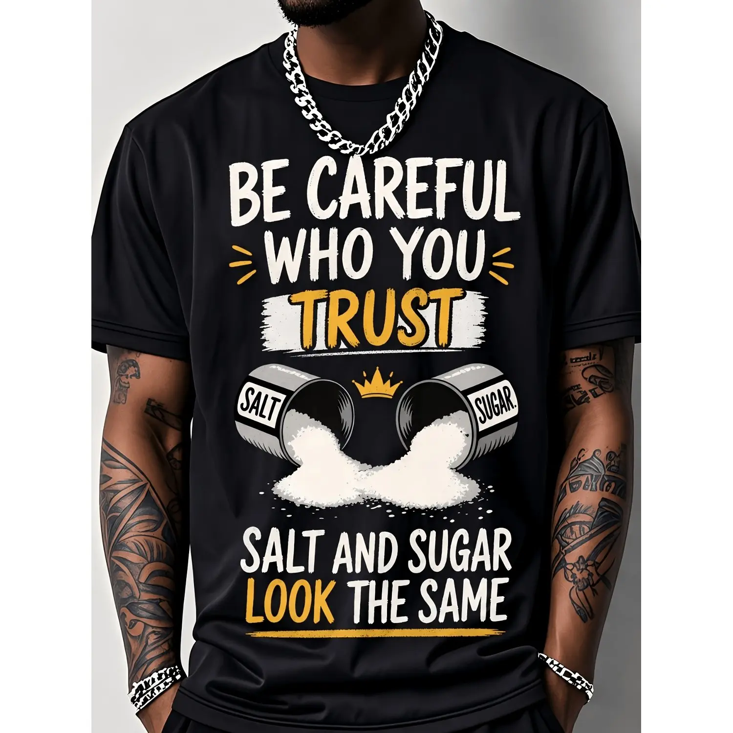Black Short-Sleeved New T-shirt Featuring Bold "BE CAREFUL WHO YOU TRUST" Graphic Unique Design with Overturned Salt And Sugar Shakers Perfect for Streetwear Lovers Embodies Cautionary Message About Trust And Appearances Comfortable