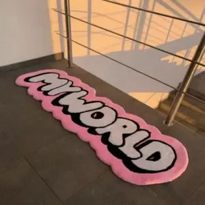 A pink irregular wavy edge shape letter carpet bedroom decoration plush carpet trendy personalized living room carpet MY WORLD letter bedside strip carpet modern simple lounge cloakroom carpet Fluffy Rug Home Decorative Rug Super Fluffy Rug