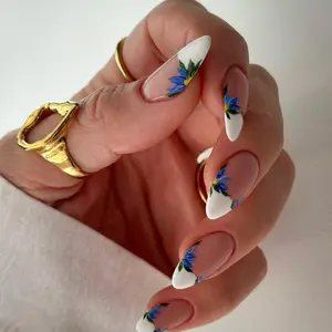 SHEDARES Blue Floral French – Handmade Nude Almond Press-On Nails with Delicate Blue Floral Accents & White Tips | Elegant Everyday, Holiday Party & Minimal Chic