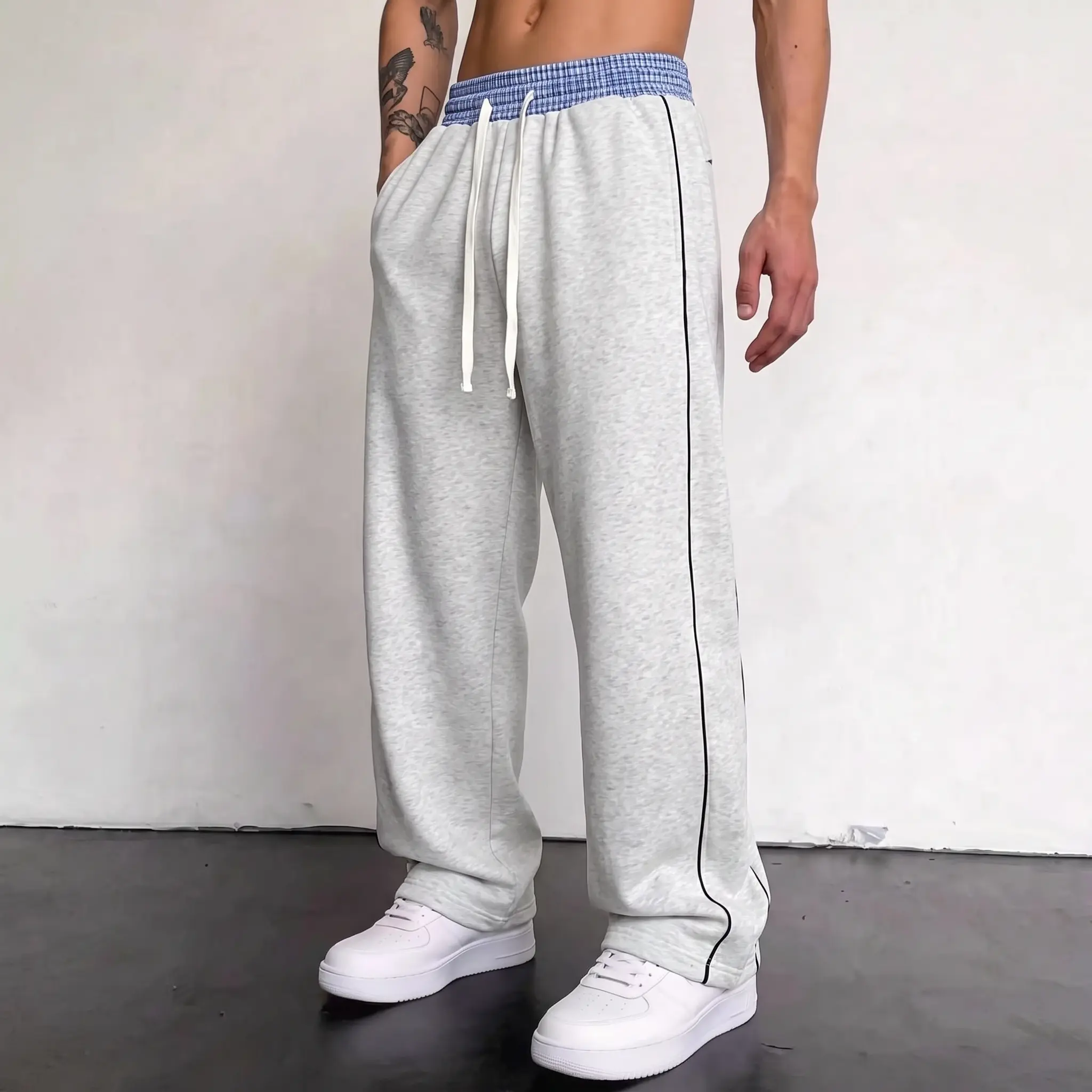 Men’s cotton casual long pants with a loose straight fit and side stripe design, soft and comfortable drawstring joggers suitable for streetwear, workouts, and everyday wear.