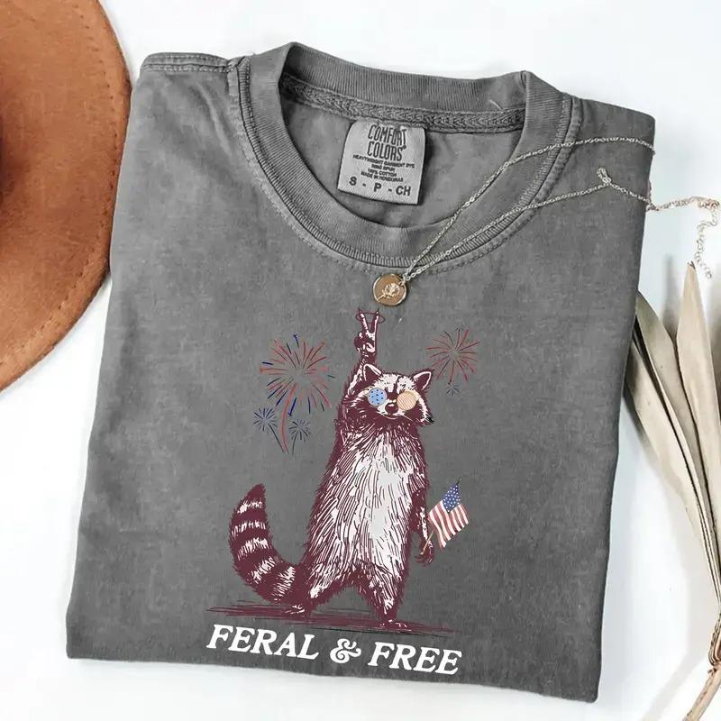 Feral and Free Raccoon Comfort Colors Shirt, Funny Patriotic Raccoon Tee, Fourth of July Graphic T-Shirt, Retro America Freedom Shirt, Cute Feral Raccoon Comfort Colors Tee