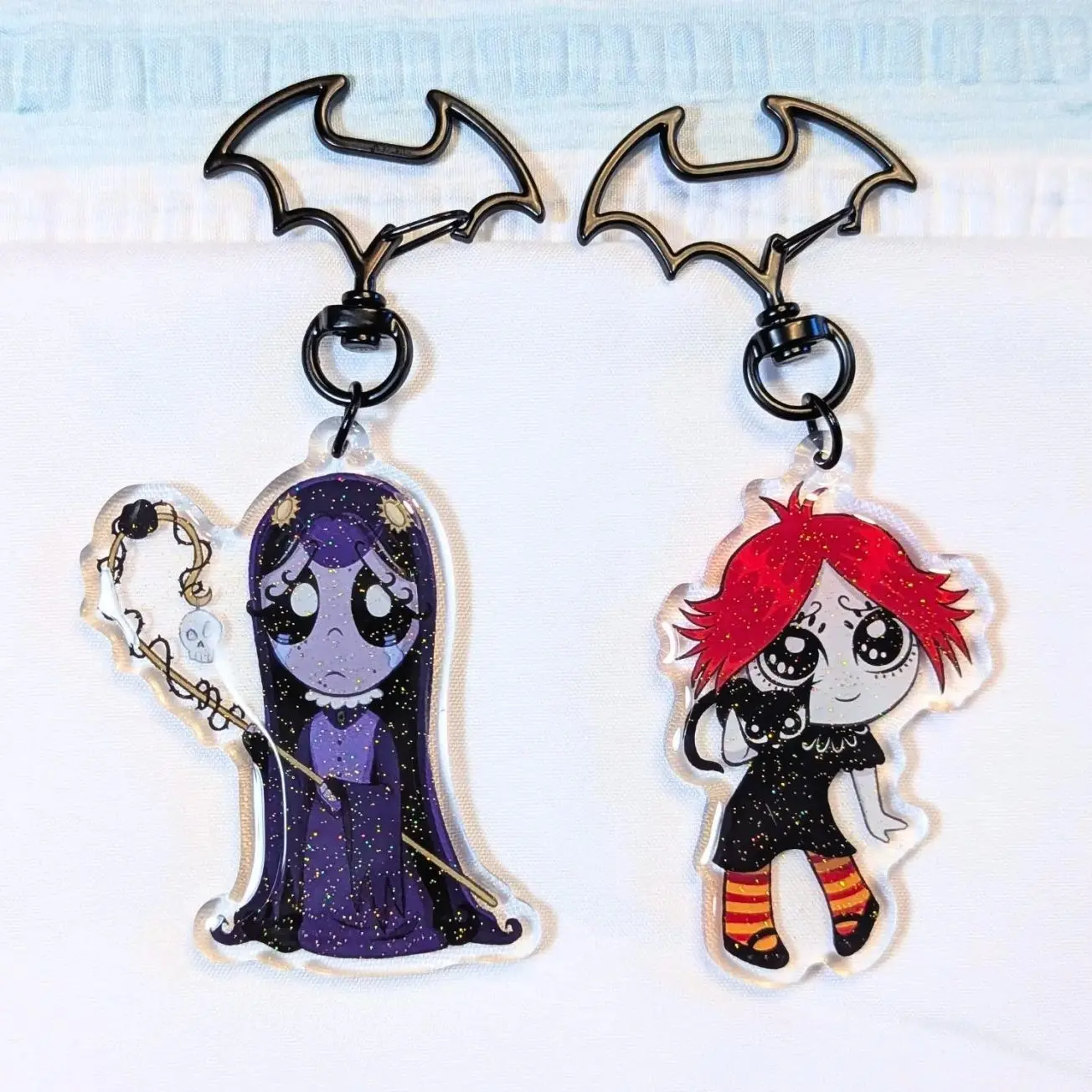 2 ops Gloomy Girl Glitter Acrylic Keychain