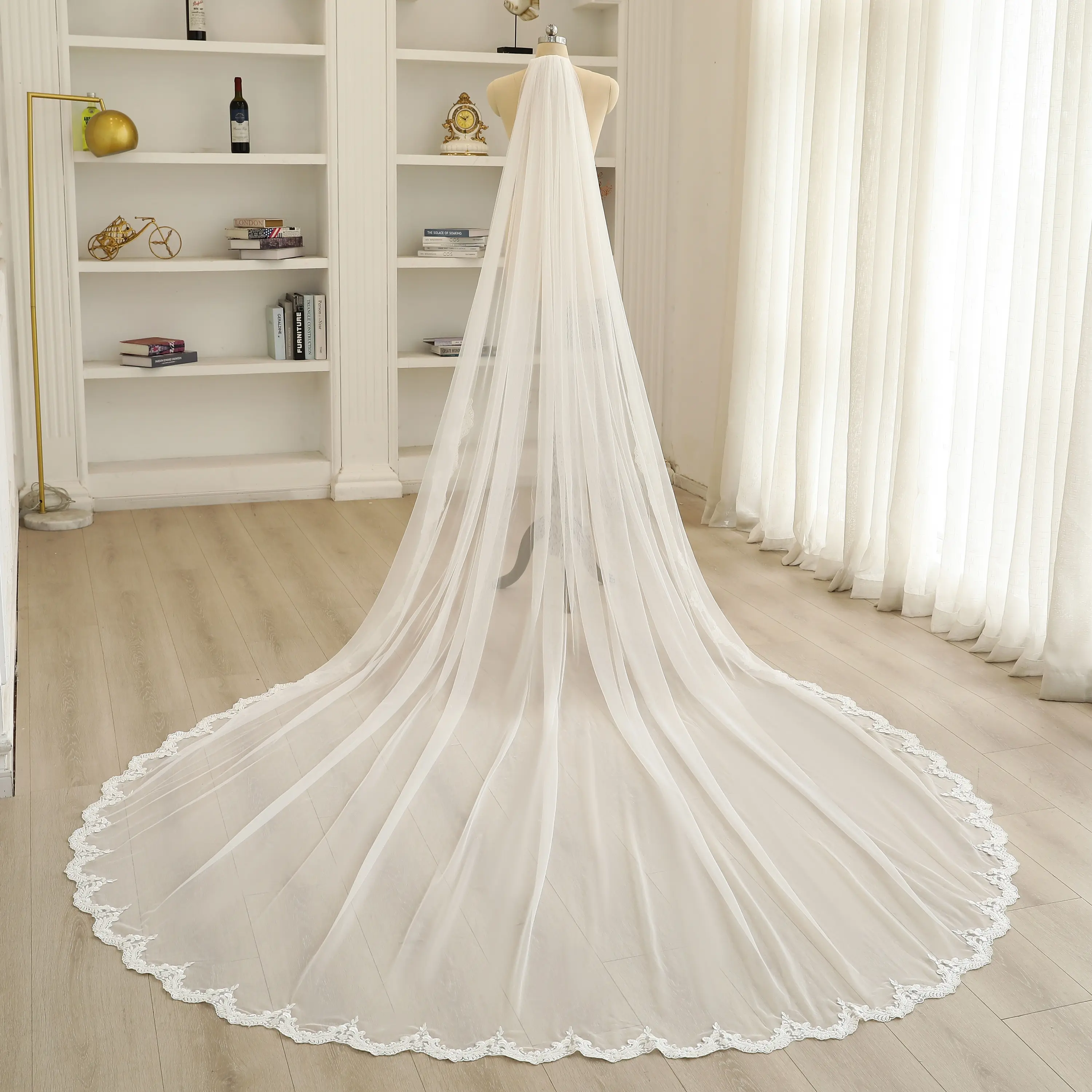 Beaded embellishments, elegant sheer floral lace cathedral-length wedding veil.